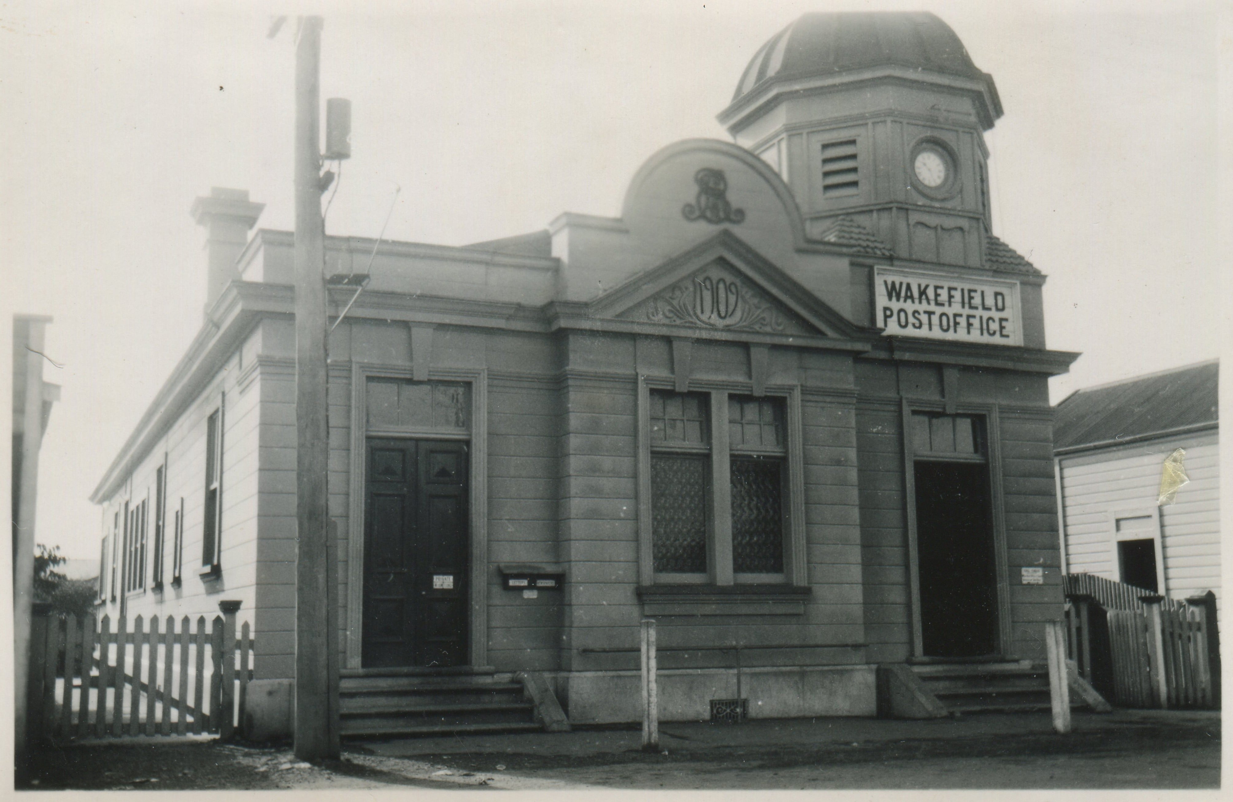 Black and white photo of the original front entrace of the Wakefield post office.